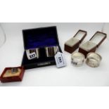 A lot comprising two pairs of cased silver napkin rings, London and Birmingham marks and a silver
