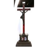 An enamelled copper christ on cross with iron base Condition Report: damage to enamel and