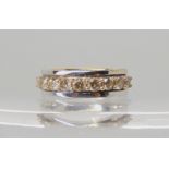 A 9ct white gold ring set with estimated approx 0.70cts of champagne colour diamonds, finger size