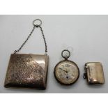 A lot comprising a white metal purse, a silver vesta and a silver cased pocket watch Condition