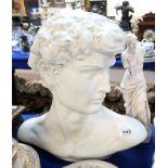 A ceramic bust of Michaelangelo's David and a classical style plaster figure Condition Report: