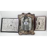 A lot comprising a modern silver mounted photo frame, Birmingham 1997 and two similar telephone