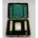 A cased silver vesta and cigarette holder cases a near set, Birmingham 1903 and 1902 Condition