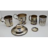 A lot comprising two silver mugs, London 1933, Birmingham 1925, a silver beaker, an inkwell (def)