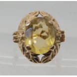 A 9ct gold citrine set ring the bezel designed as leaves and flowers, size L, weight 6.3gms