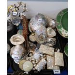 A collection of mother of pearl items including cigarette cases, two Chinese counters, unworked