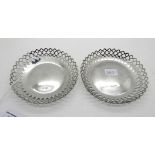 A pair of silver dishes with pierced decoration, Sheffield 1915, 12.5cm diameter, 163gms Condition