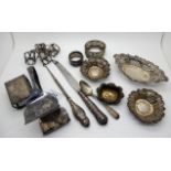 A mixed lot of silver items, bon bon dishes, napkin rings, cake tongs (def), salts, assorted