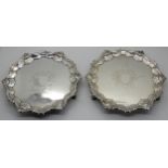 A pair of silver card trays, London 1751, of circular form with scalloped edge and shell motif on