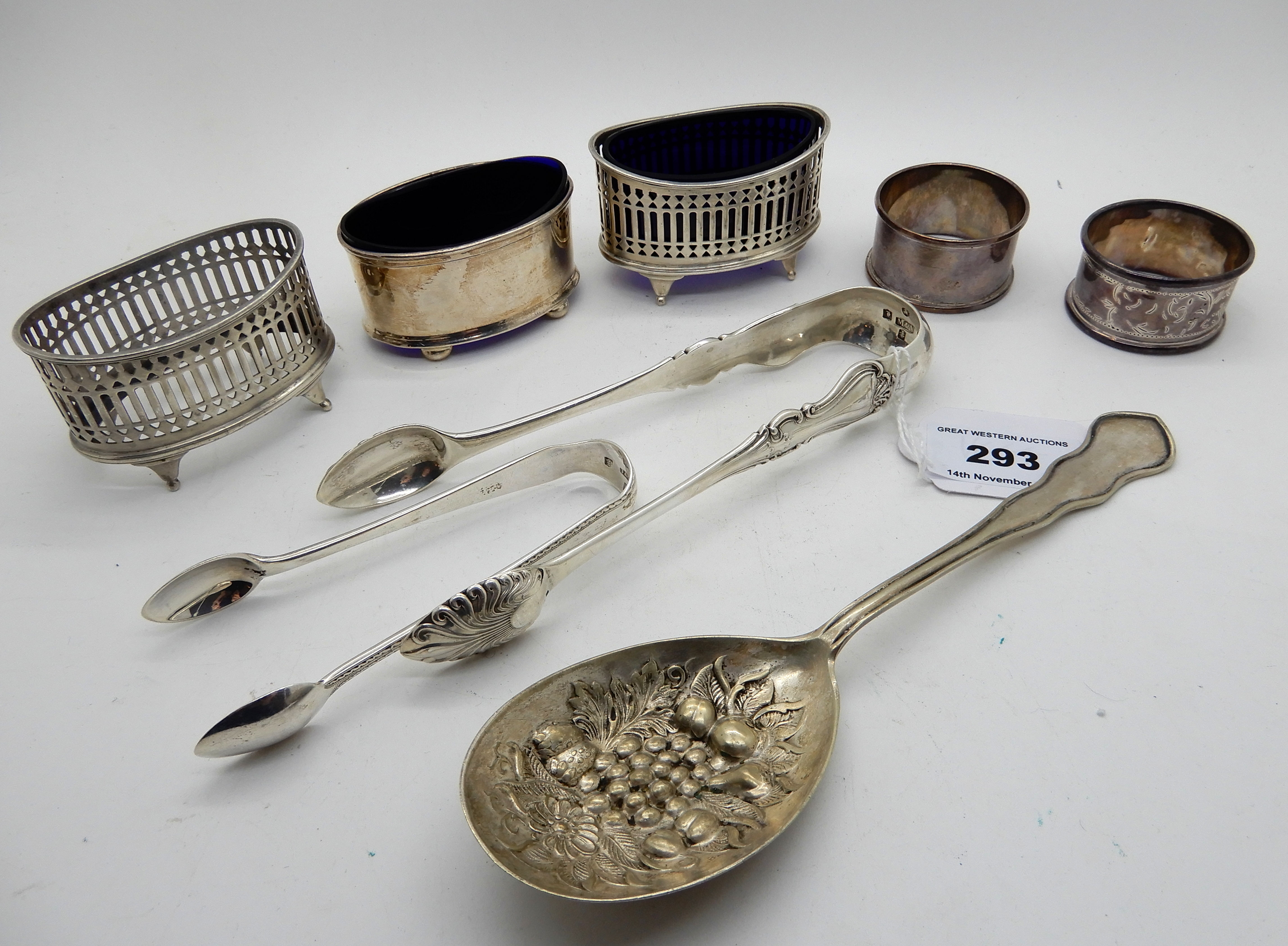 A lot comprising three silver salts, two pairs of sugar tongs (assorted marks), two EP napkin