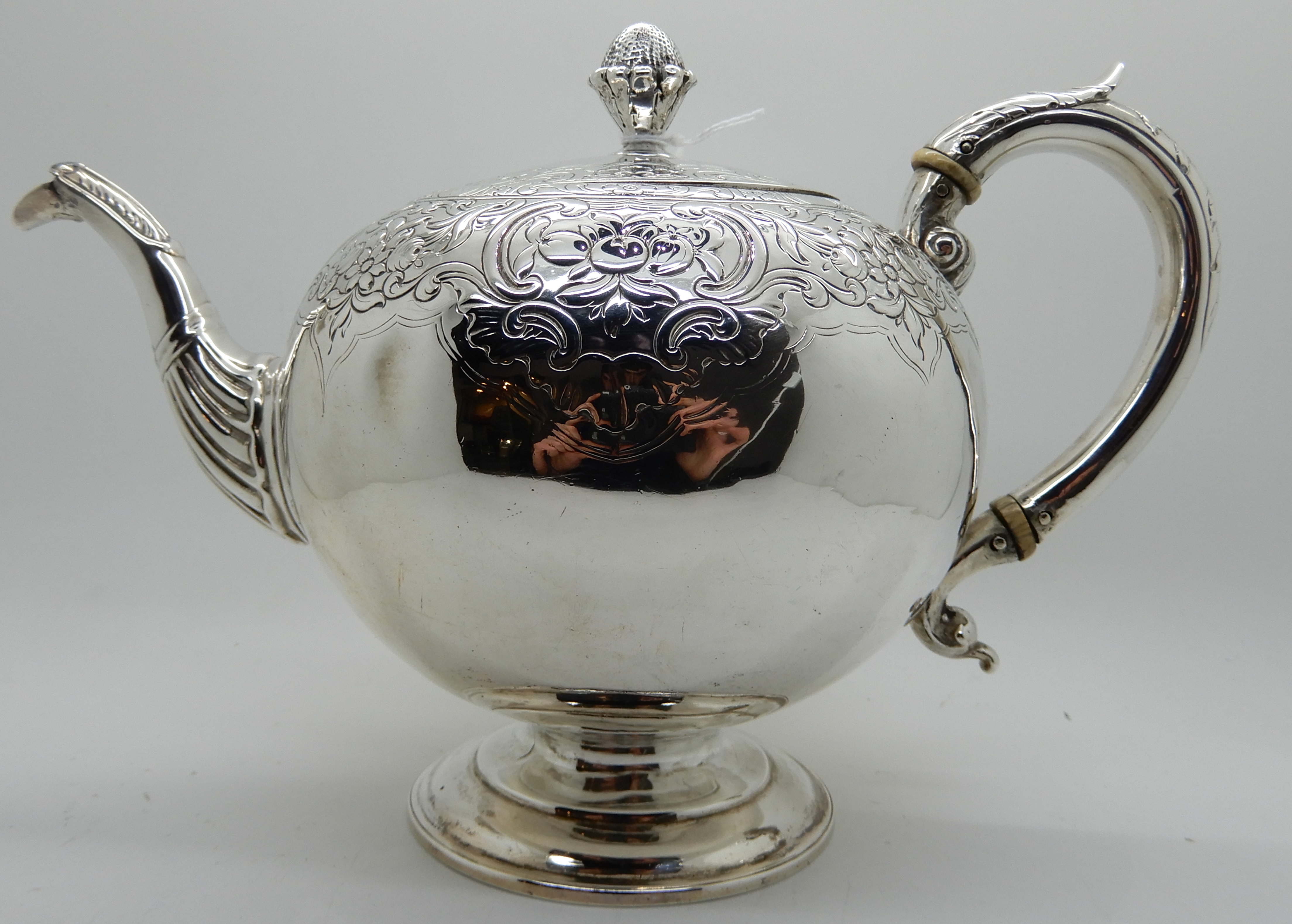 A silver teapot, Edinburgh 1804, of globular form with engraved decoration, 17cm high, 600gms - Image 2 of 4
