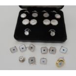 Silver and mother of pearl cufflinks and shirt studs set with a blue gem, together with a boxed