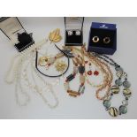 A string of goldstone glass beads, agate beads and other items Condition Report: Not available for