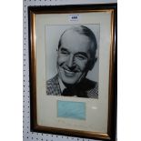 A Maurice Chevalier autograph framed with black and white photograph Condition Report: Available