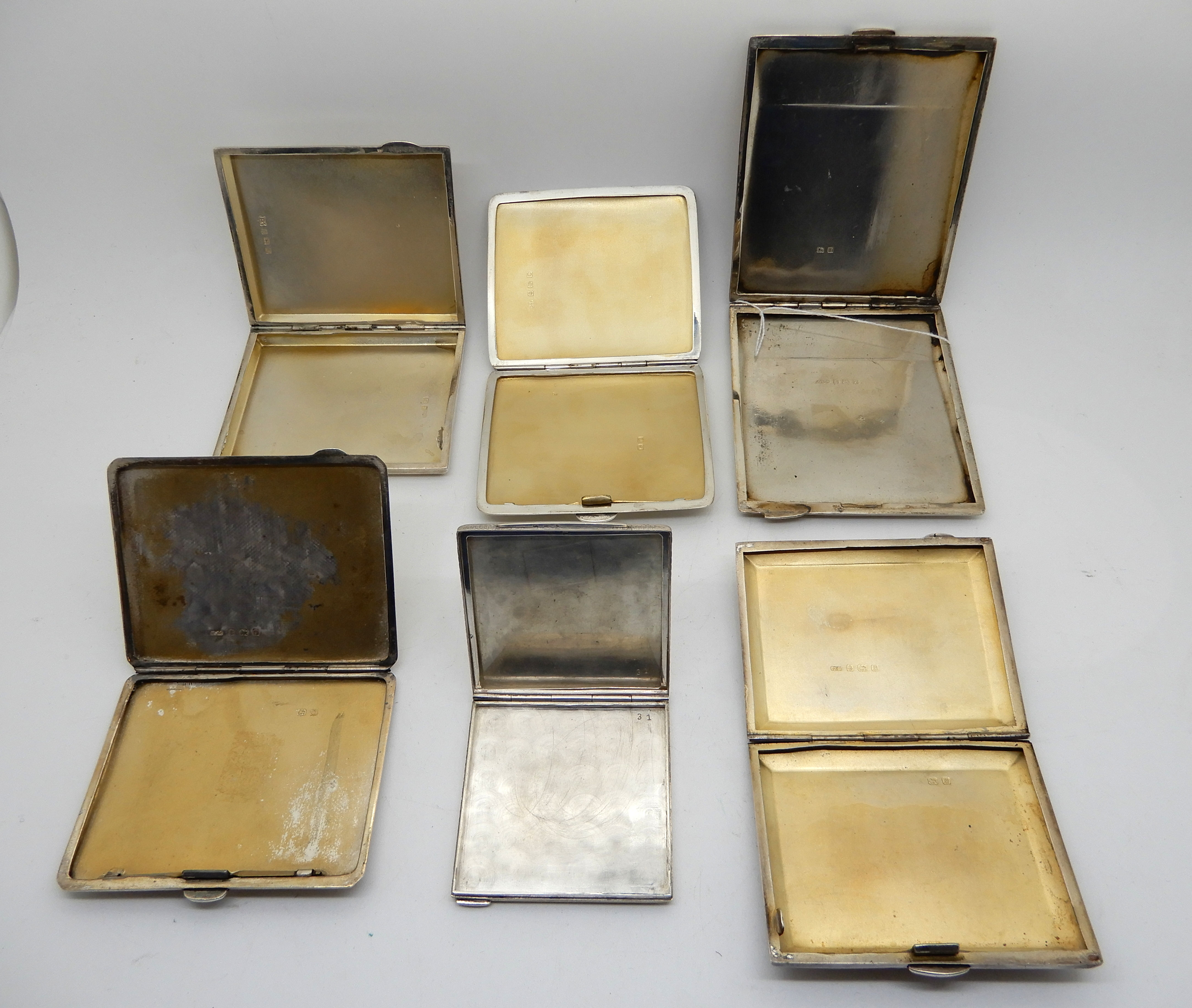 A lot comprising five silver cigarette cases and a cased commemorative white metal compact, 497gms - Image 2 of 2