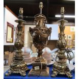 A pair of gilt metal table lamps and a urn shaped table lamp Condition Report: Available upon