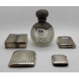 A lot comprising two silver cigarette cases, a silver vesta, a silver cigarette box and a silver