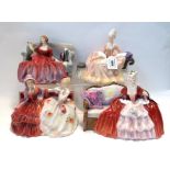 Four Royal Doulton figures including Belle o the Ball, Reverie, Sweet and Twenty and The Gossips