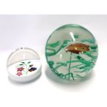 A Murano glass fish globe weight together with a Caithness Whitefriars Pansy weight no 44/250