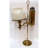 A brass paraffin lamp Condition Report: chips to the bottom rim.