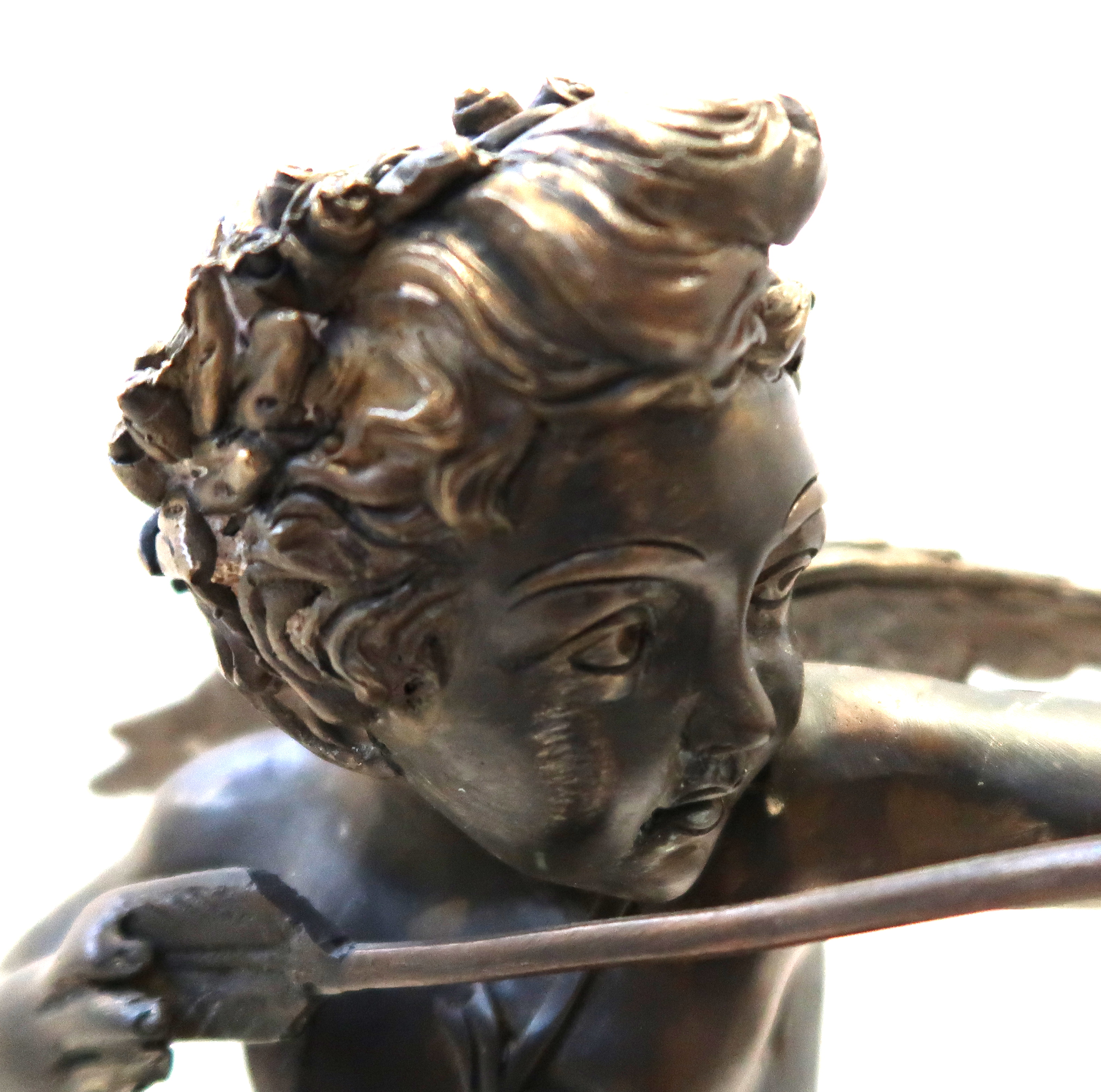 A bronze of a cherub, upon gilt plinth, 35cm high Condition Report: Available upon request - Bild 2 aus 3