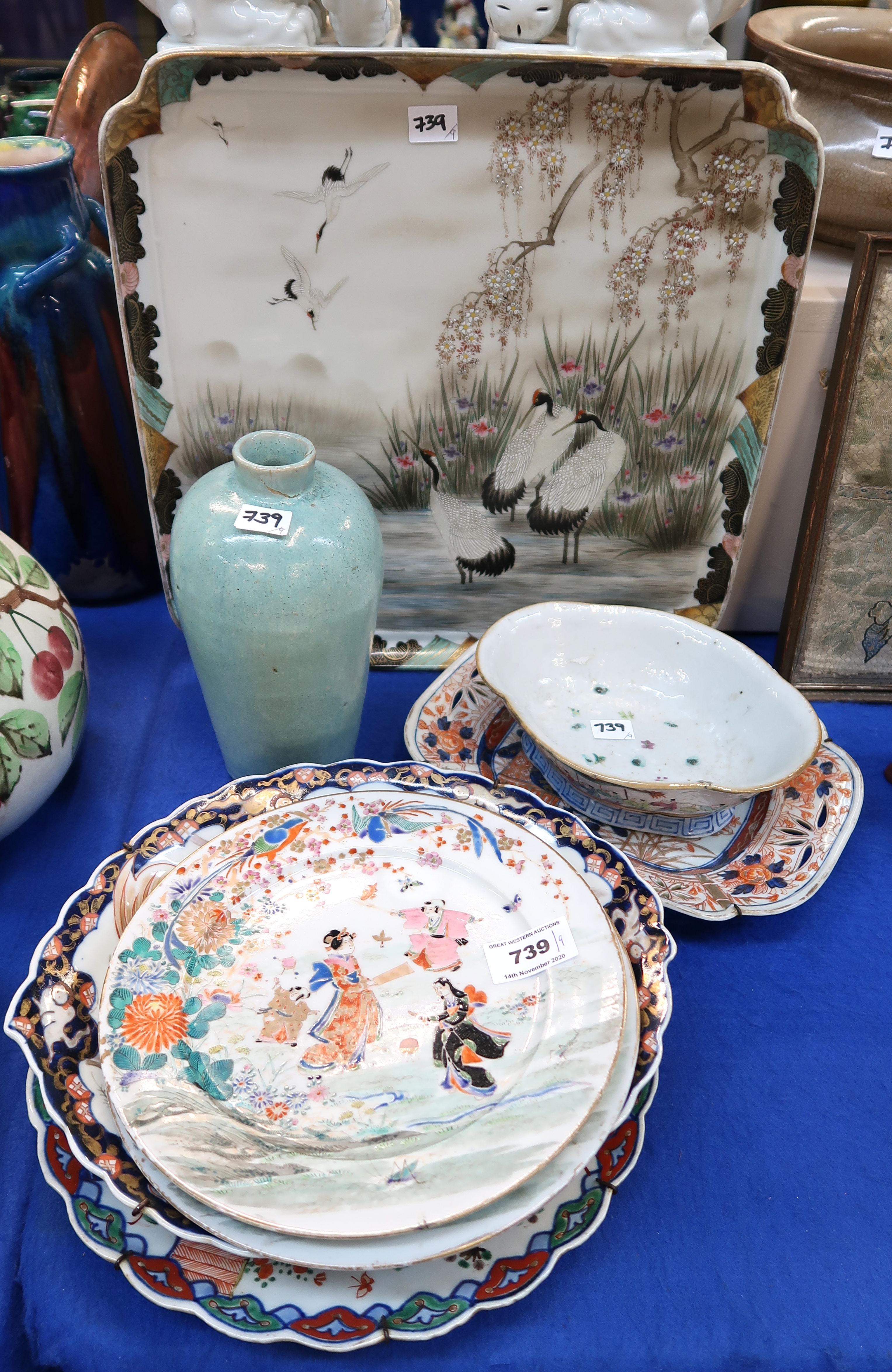 A Japanese stork decorated tray, a green glazed tray, Imari dish, a pair of plates etc (9) Condition