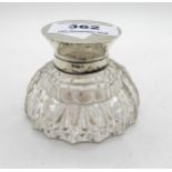 A silver topped cut glass inkwell, 5.5cm high Condition Report: Available upon request