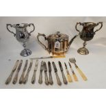 A tray lot of EP - trophy cups, teapot, loose cutlery Condition Report: Available upon request