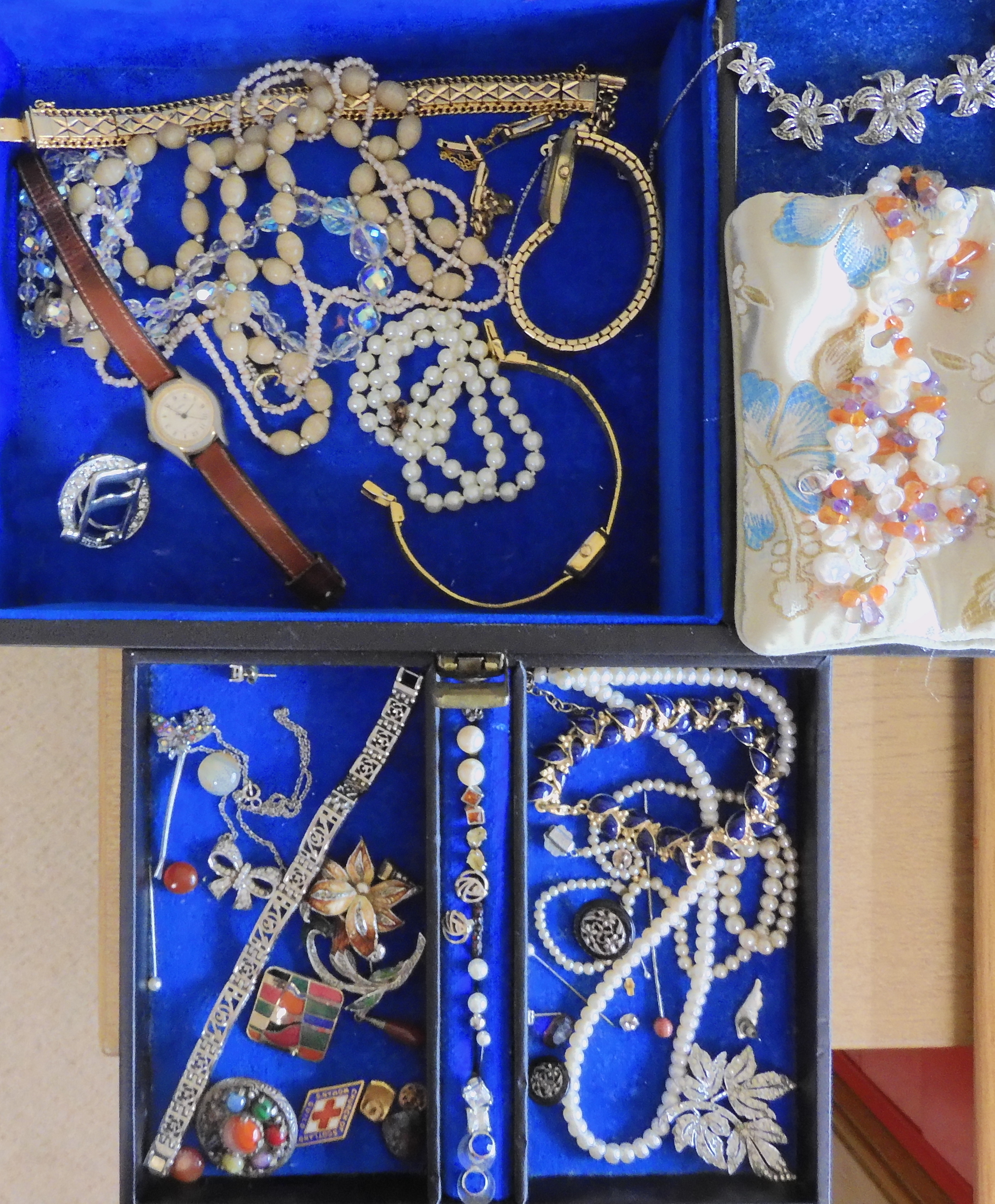 A jewellery box full of vintage costume jewellery to include a Miracle brooch and String of Honora