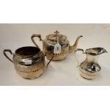 A three piece silver plated tea service Condition Report: Available upon request