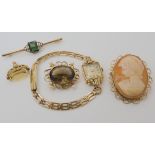 A 9ct cameo brooch 4.2cm x 3.6cm, a 9ct green gem brooch, a yellow metal smoky quartz and pearl