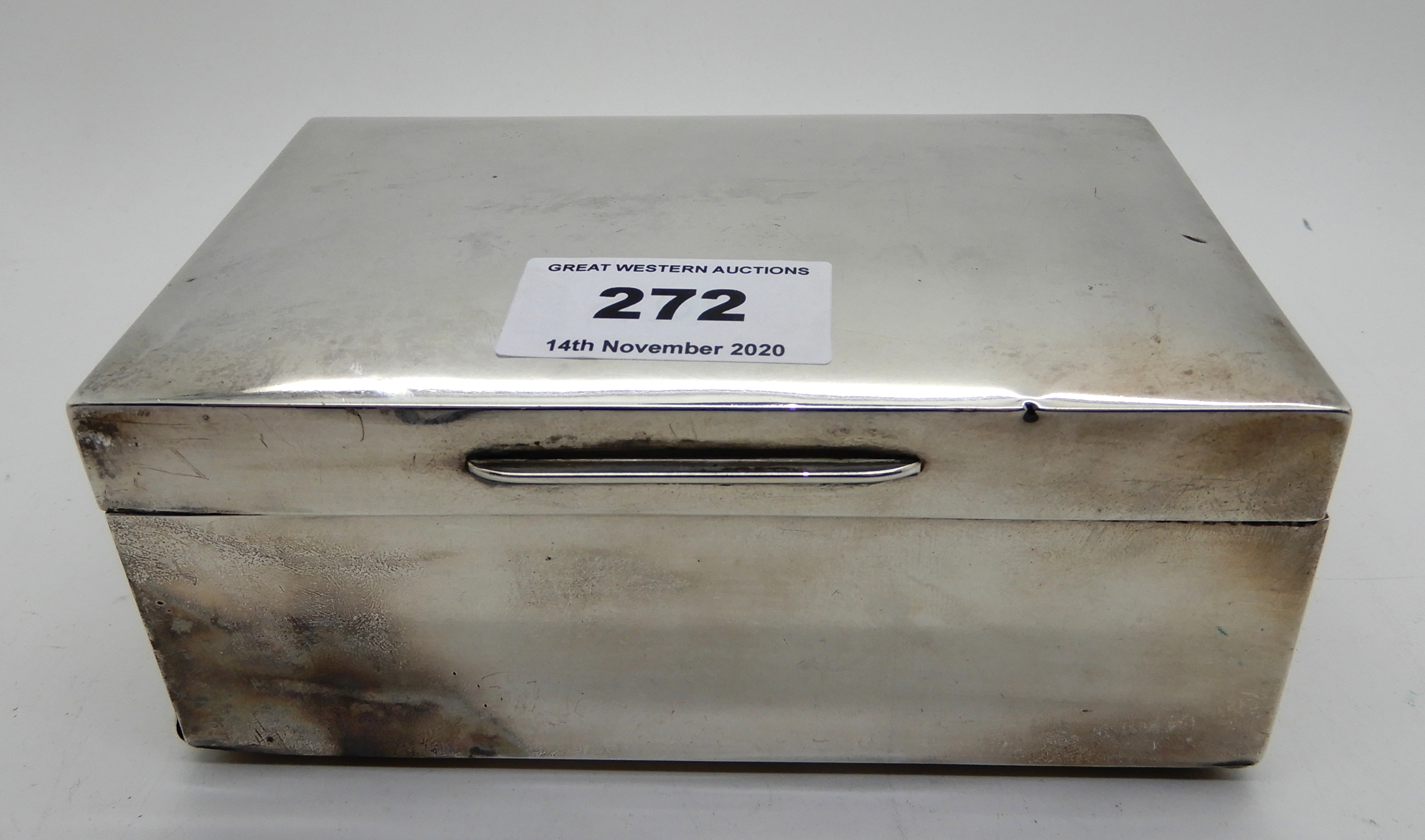 A silver cigarette box, London 1928, 14cm x 9cm Condition Report: Available upon request