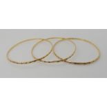 Three 9ct gold bangles inner diameter approx 7.1cm, combined weight 20.7gms Condition Report: