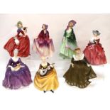 Seven Royal Doulton figures including Symphony, Autumn Breezes, Genevieve, Geraldine, Charlotte,