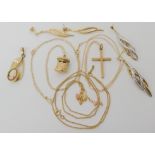 Three 9ct gold pendants to include a cross, bunch of grapes and a postbox together with other items,