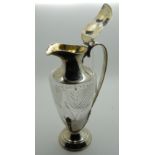 A silver mounted cut glass claret jug, rubbed marks (with losses), 25.5cm high Condition Report: