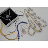 Two silver and tanzanite necklaces, silver and paste jewellery and statement faux pearls Condition