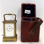 A miniature brass and glass carriage clock in travelling case, with key Condition Report: Dial