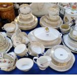 A Royal Doulton Sovereign pattern dinner service comprising twelve dinner plates, soup coupes and