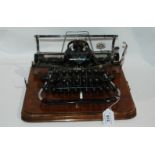 An early 20th Century Blickensderfer typewriter (pre-qwerty) in oak case and carry case Condition