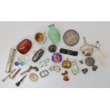 A collection of glass seals in a holder, bonzo dog brooches, amber items etc Condition Report: Not