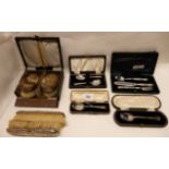 A lot comprising a pair of silver backed brushes, a cased pair, a christening set, a pair of cased