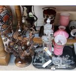 A root wood table lamp, a pink glass oil lamp, a table lamp with lustre drops, an assortment of