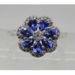 A 14k white gold ceylon sapphire and diamond flower ring, size S1/2, with a Gemporia certificate