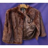 Two brown fur jackets and a print (3) Condition Report: Available upon request