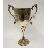 A silver plated twin handled curling trophy on three broom supports, 34cm high Condition Report: