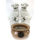 A pair of blanc de chine kylins and a bowl with applied marks Condition Report: Available upon