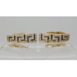 A pair of 18ct gold Greek key pattern earrings set with diamonds, length 2.1cm, weight 12.1gms (