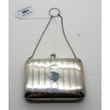 A silver purse, Birmingham 1911, rectangular with engine turned decoration and monogrammed