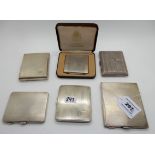 A lot comprising five silver cigarette cases and a cased commemorative white metal compact, 497gms